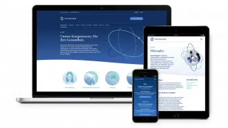 Mockup of the website on three different devices.